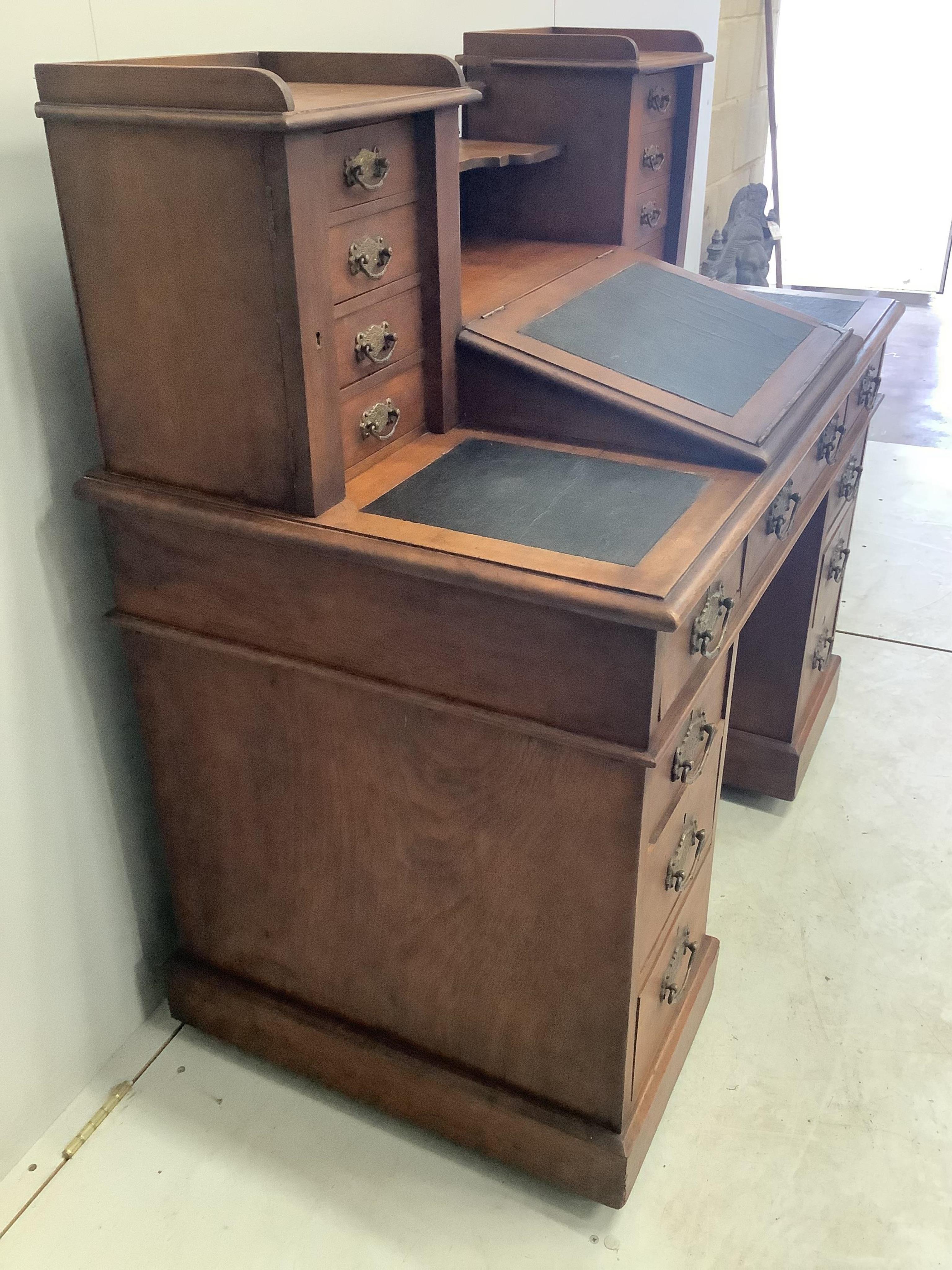 A late Victorian mahogany pedestal desk with raised superstructure, width 111cm, height 111cm. Condition - fair